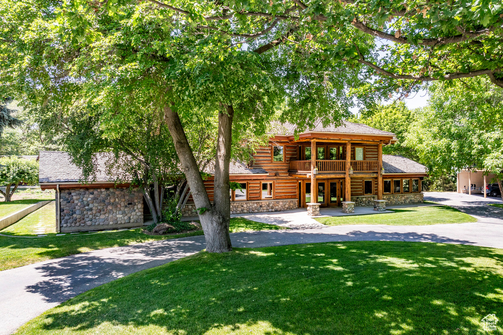 View of front of property with a front lawn