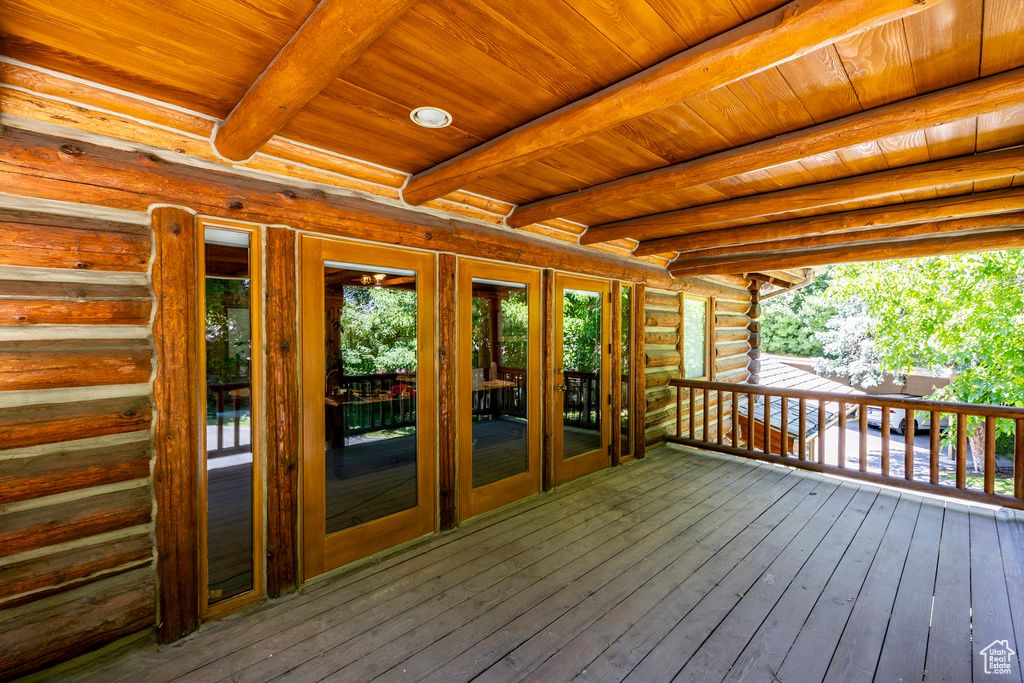 Wooden terrace featuring french doors