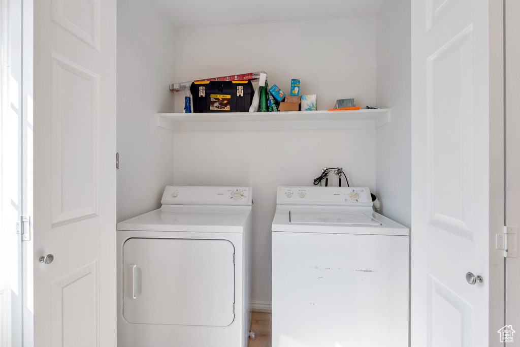 Laundry area with washing machine and clothes dryer