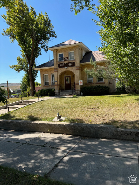 View of front of property with a front lawn