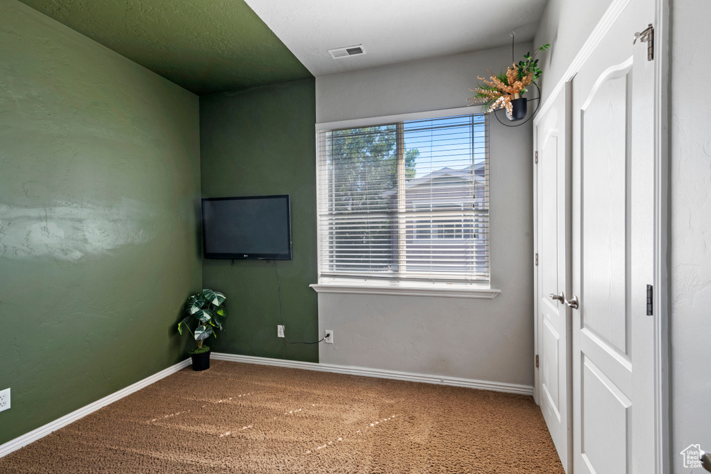 View of carpeted spare room