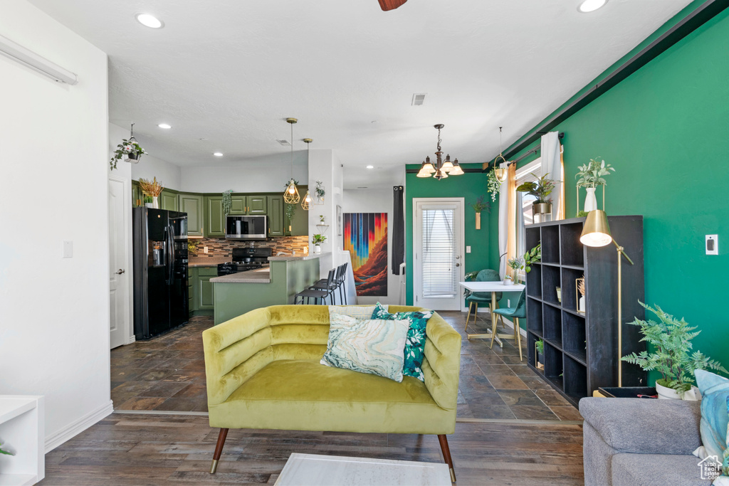 Living room featuring dark hardwood / wood-style floors and a chandelier