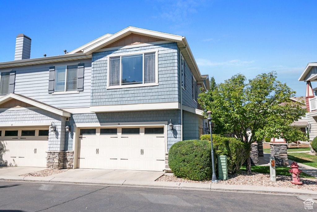 View of front of property with a garage