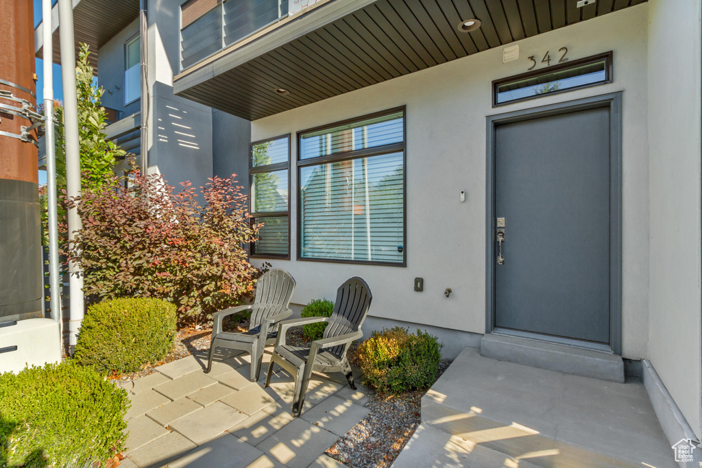 Property entrance featuring a patio area