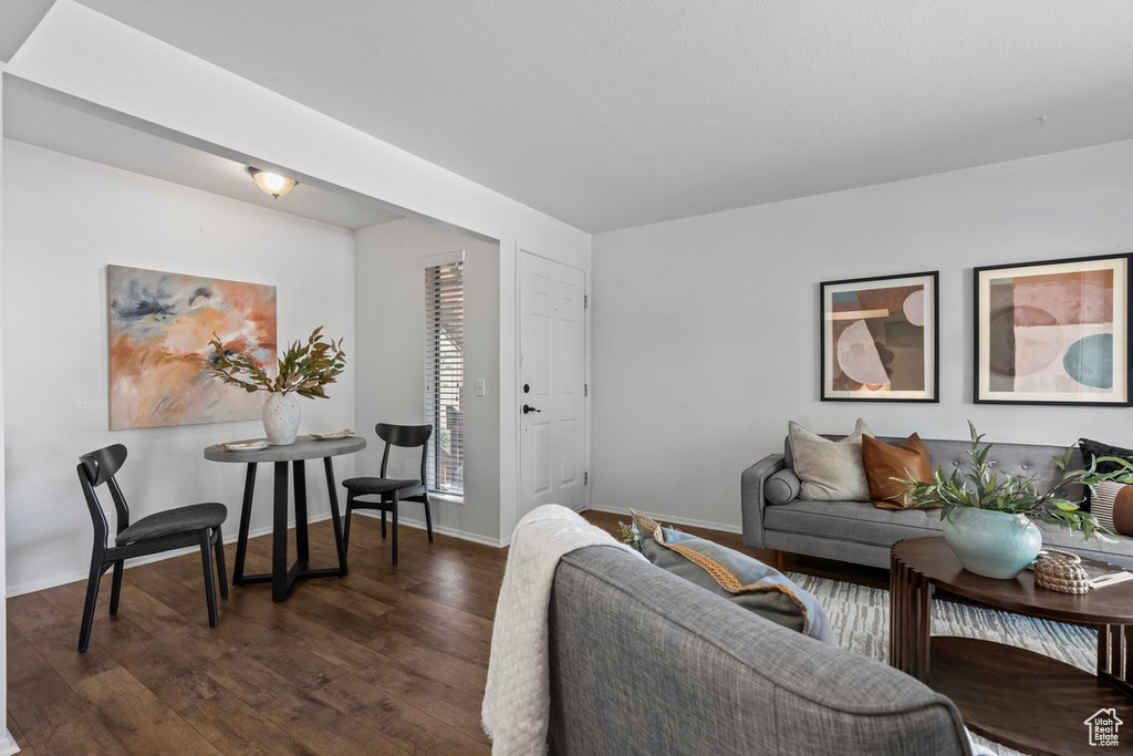 Living room featuring dark hardwood / wood-style flooring