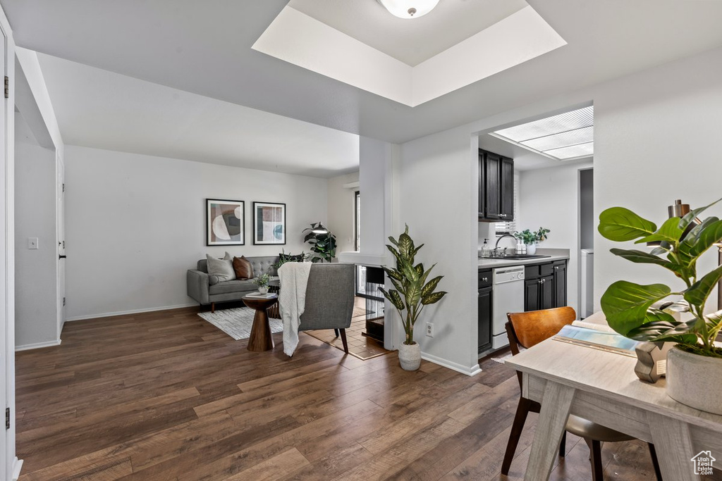 Interior space featuring a skylight, dark hardwood / wood-style floors, and sink