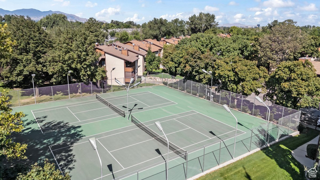 View of tennis court featuring a mountain view