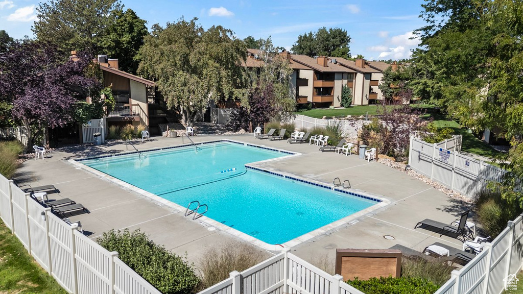 View of swimming pool with a patio area