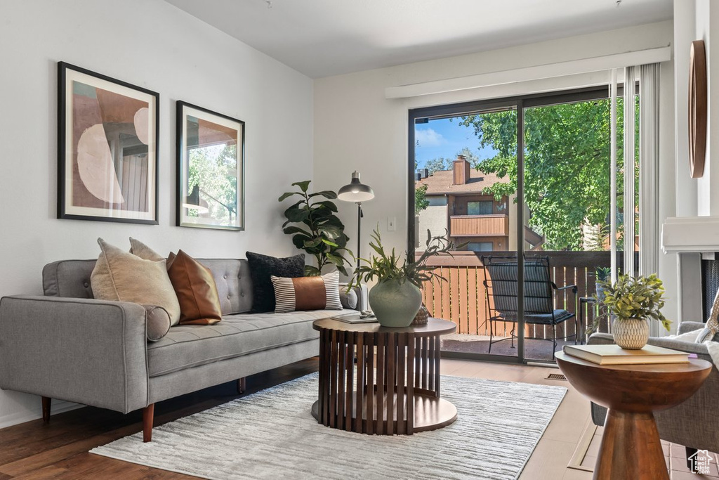 Living room with hardwood / wood-style flooring