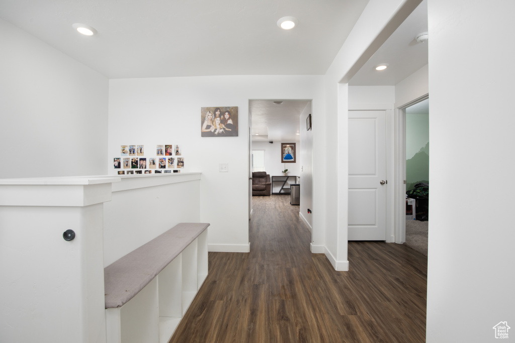 Hallway with dark wood-type flooring