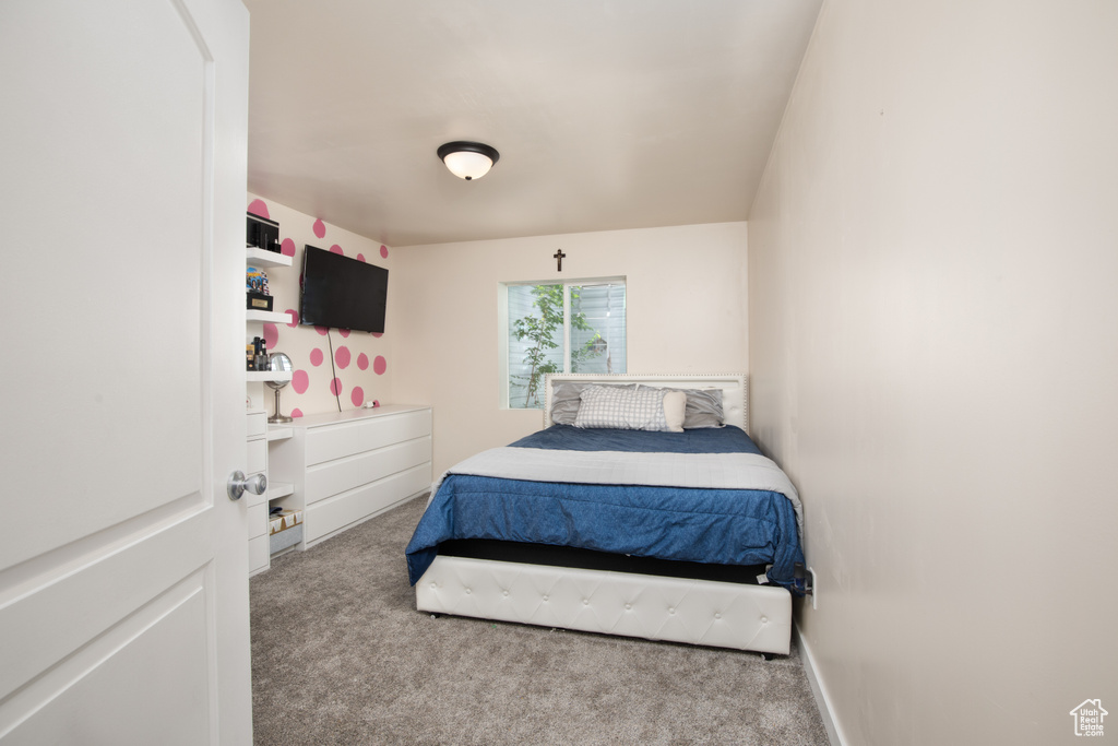 Bedroom with light colored carpet