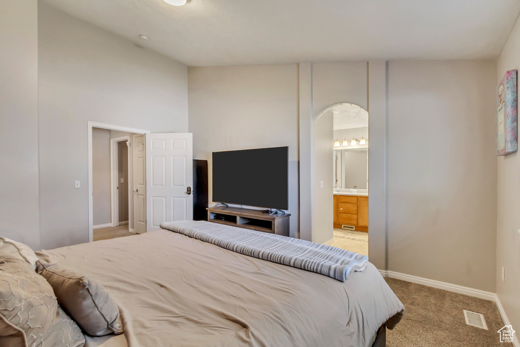 Carpeted bedroom with ensuite bath