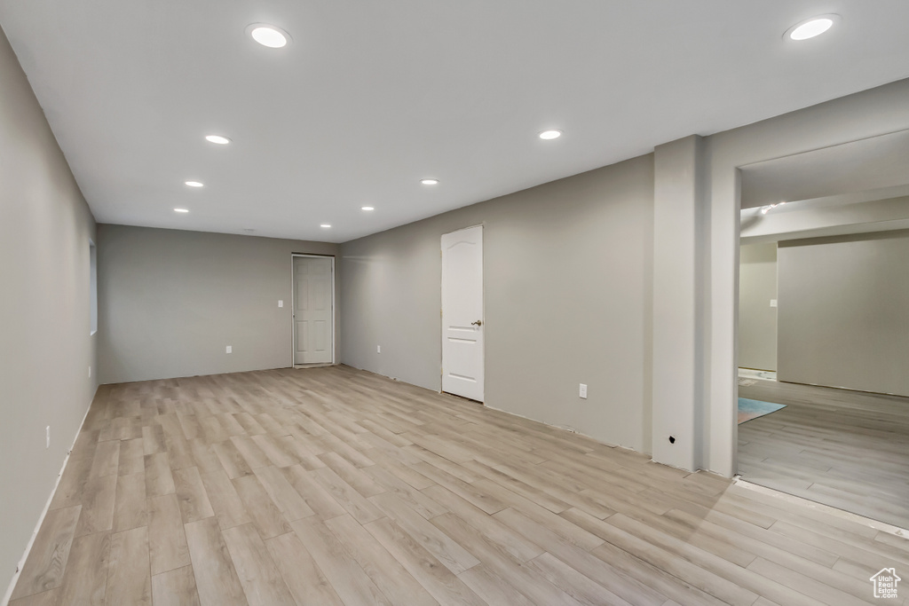 Basement featuring light hardwood / wood-style floors