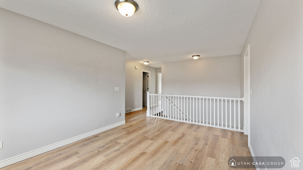 Unfurnished room featuring light hardwood / wood-style floors