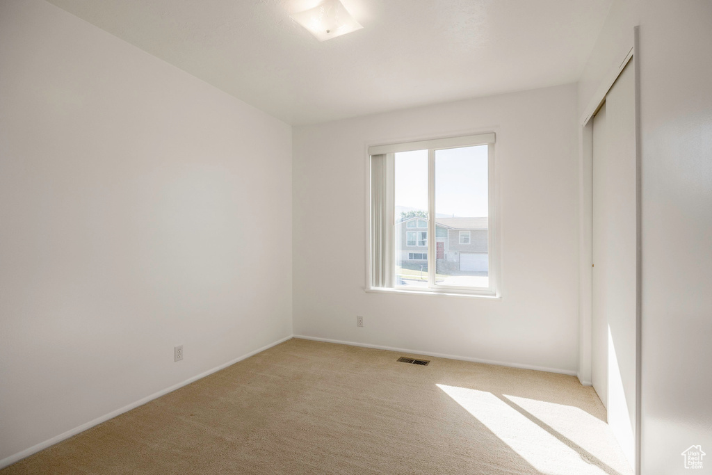 View of carpeted spare room