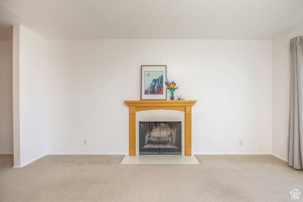 Unfurnished living room with light carpet