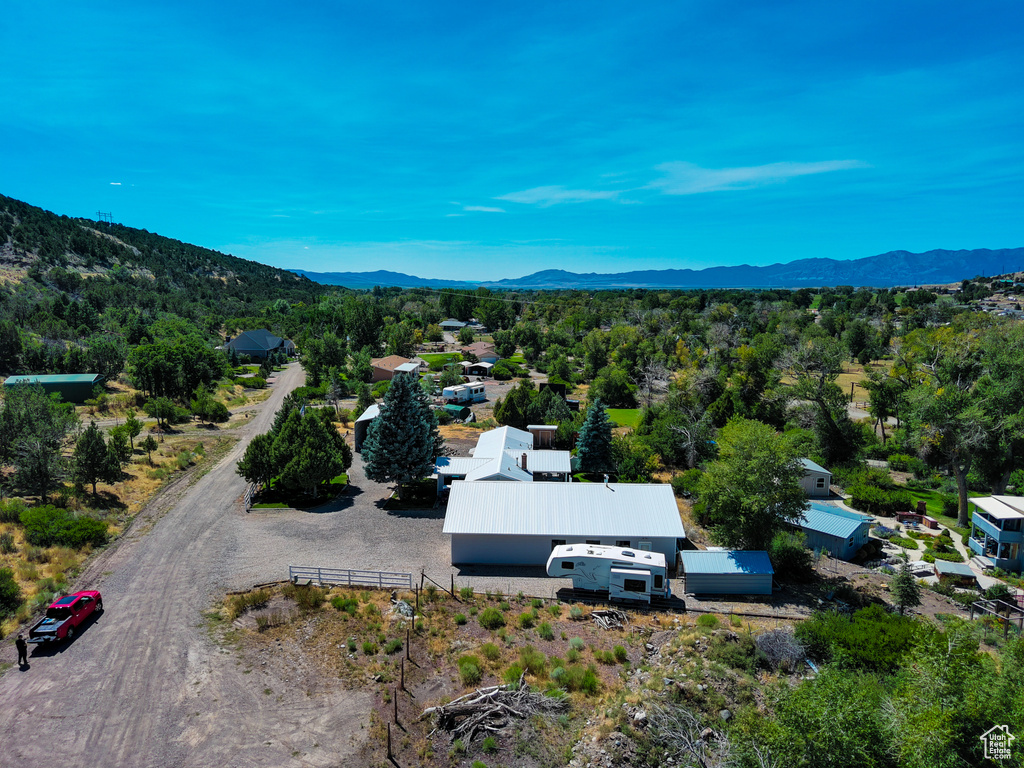 Birds eye view of property with a mountain view