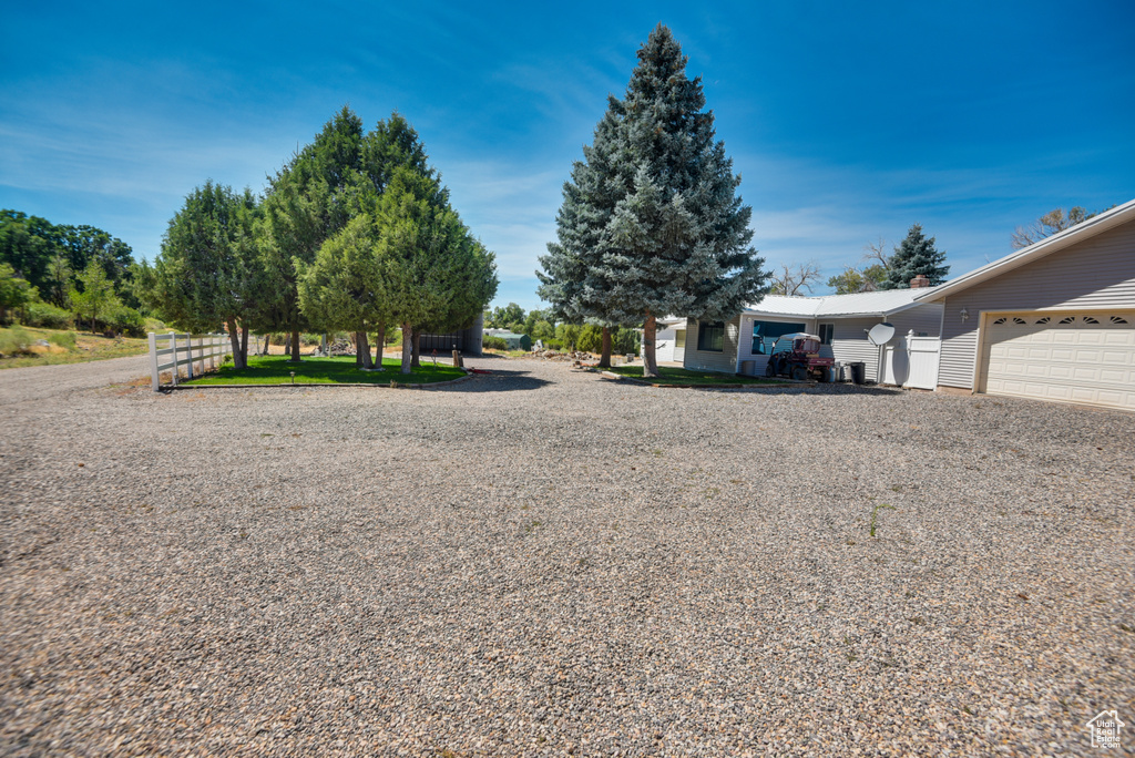 View of yard with a garage
