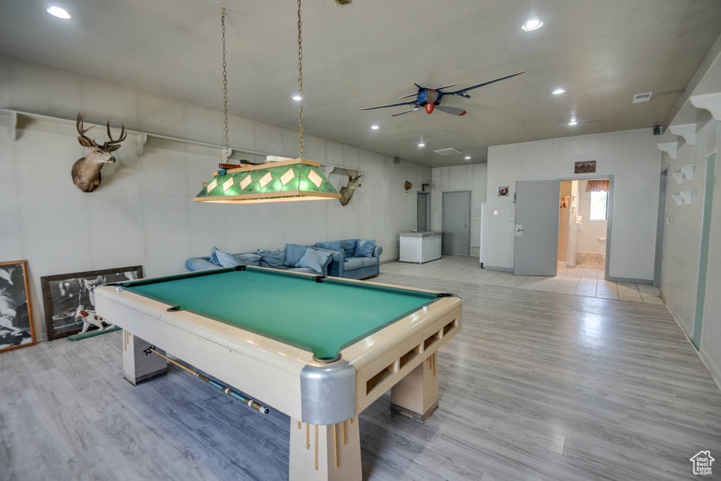 Recreation room featuring ceiling fan, pool table, and light wood-type flooring