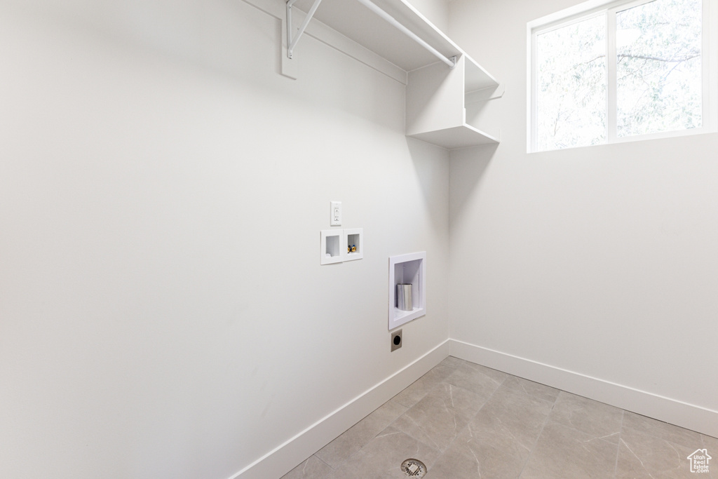 Laundry room with hookup for a washing machine and hookup for an electric dryer