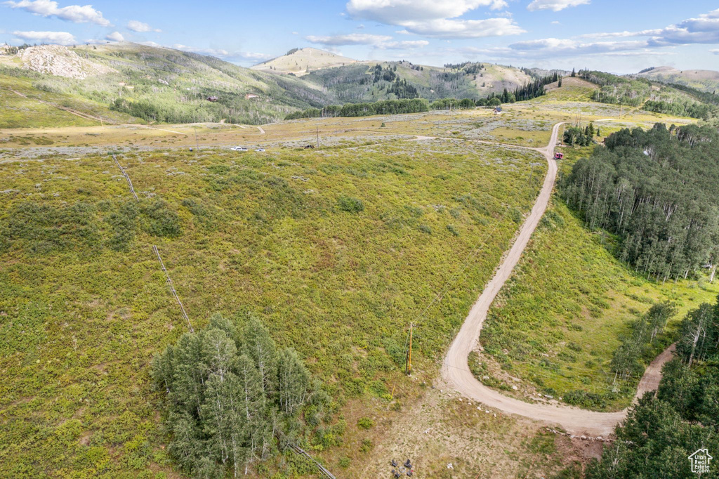 Birds eye view of property featuring a mountain view and a rural view