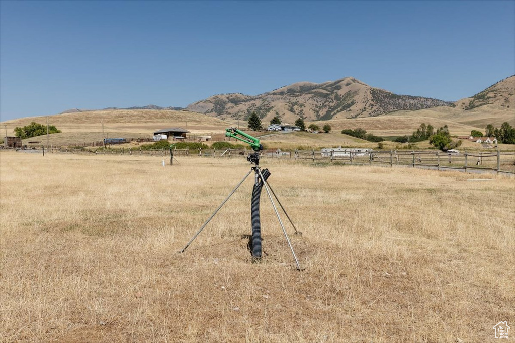 Property view of mountains with a rural view