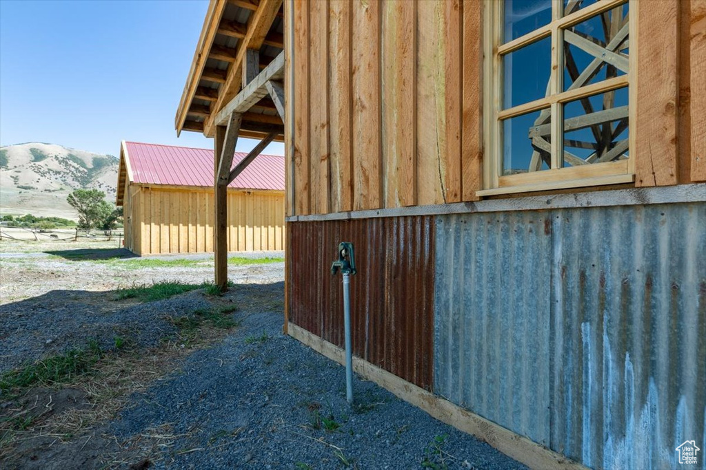 Exterior space featuring a mountain view and an outbuilding