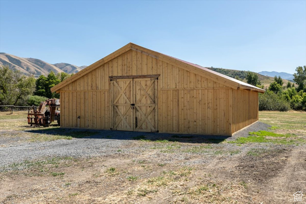 View of outbuilding featuring a mountain view