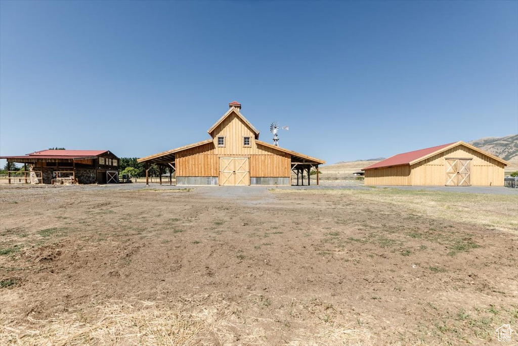 Exterior space with an outdoor structure and a rural view