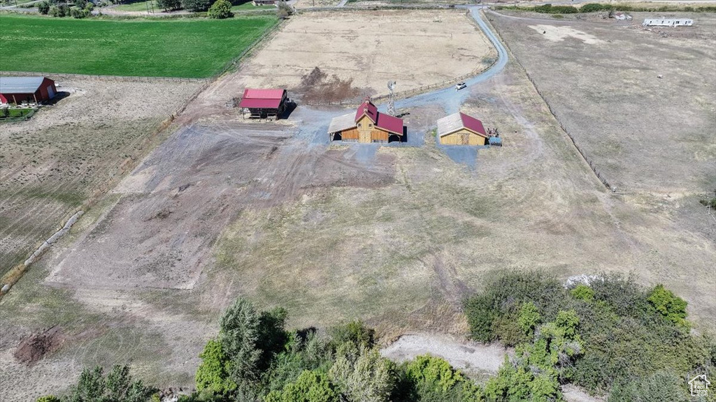 Birds eye view of property with a rural view