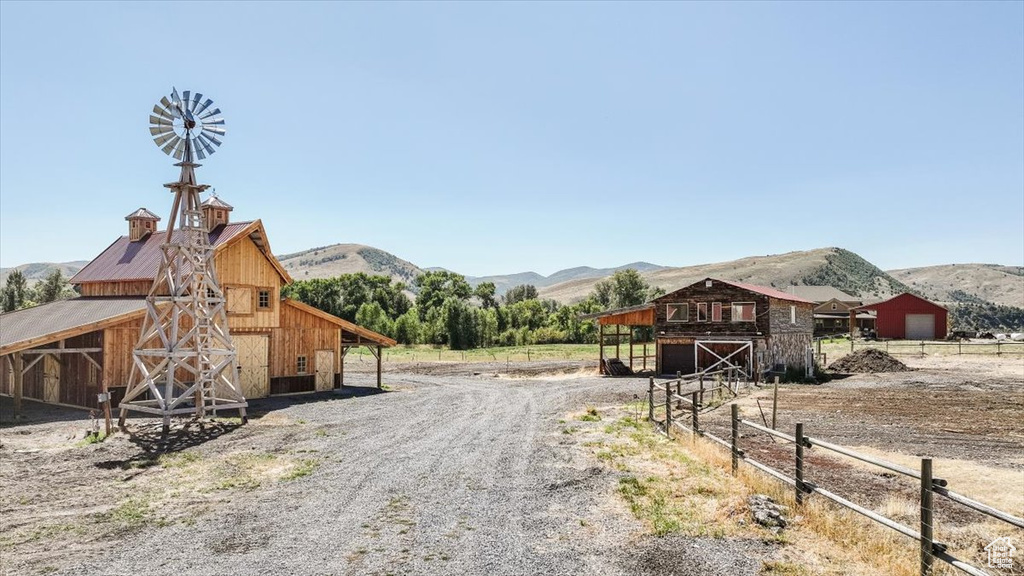 View of street with a mountain view and a rural view