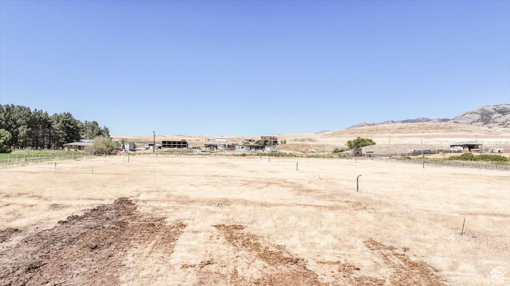 View of yard featuring a mountain view and a rural view