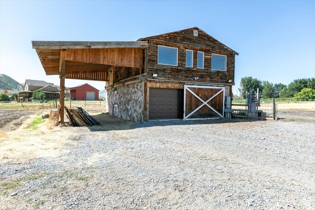 View of outdoor structure featuring a garage