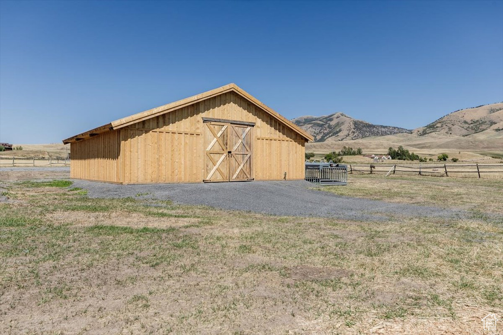 View of outdoor structure with a rural view and a mountain view