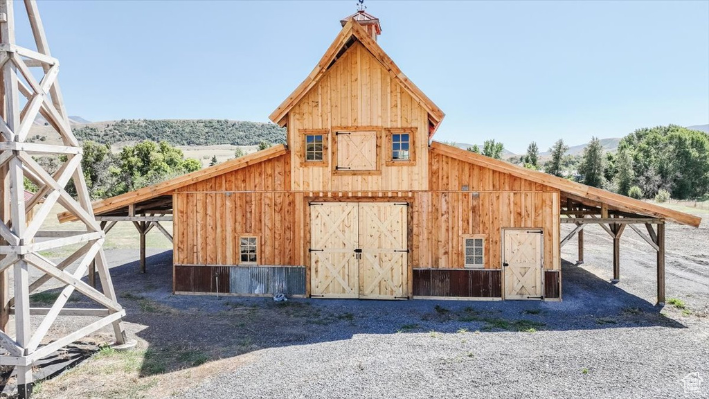 View of outbuilding with a mountain view