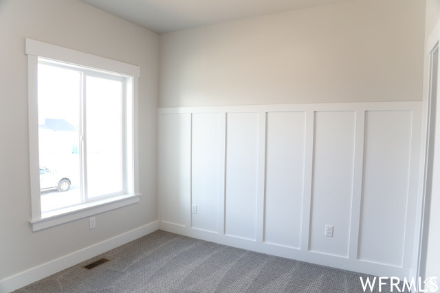 Unfurnished room featuring carpet floors