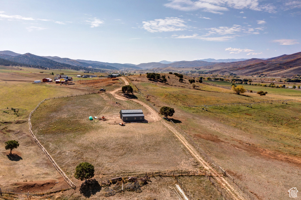 Birds eye view of property with a rural view and a mountain view