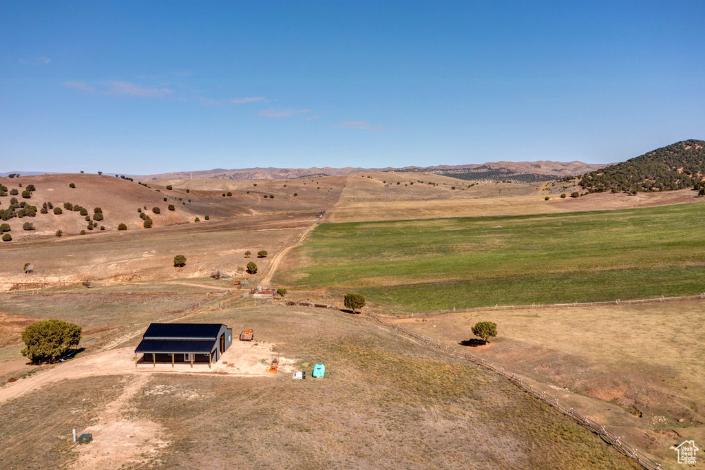 Birds eye view of property with a rural view and a mountain view