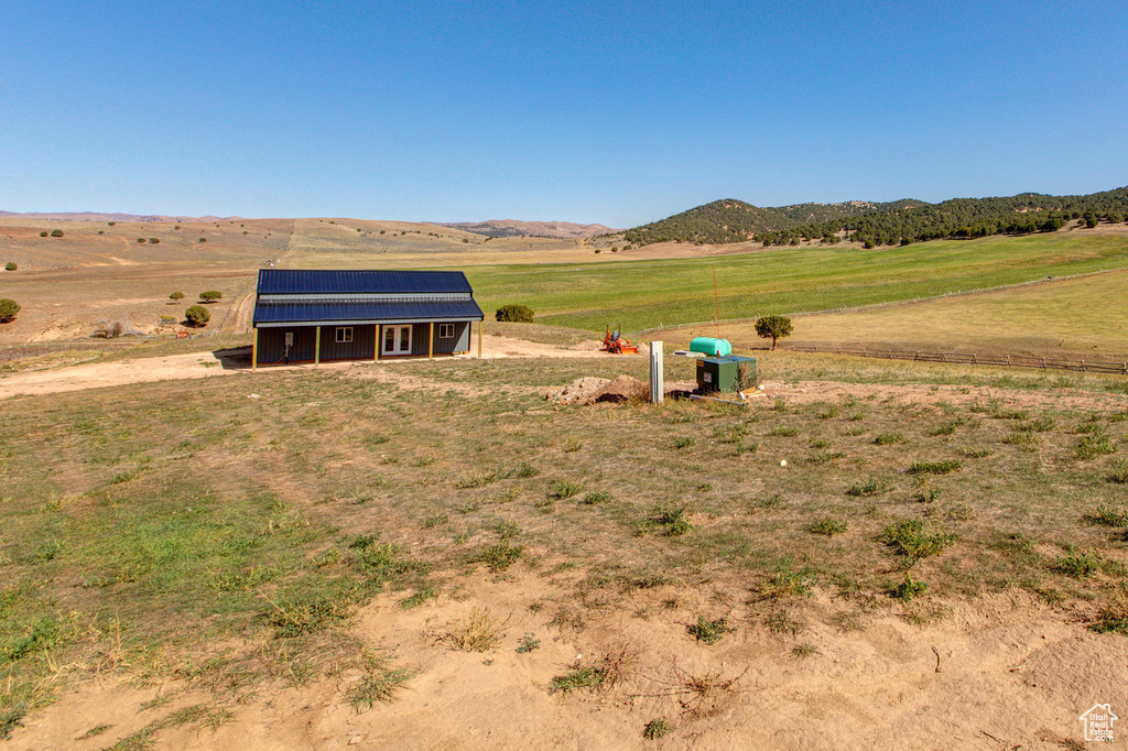 Exterior space with a rural view and a mountain view
