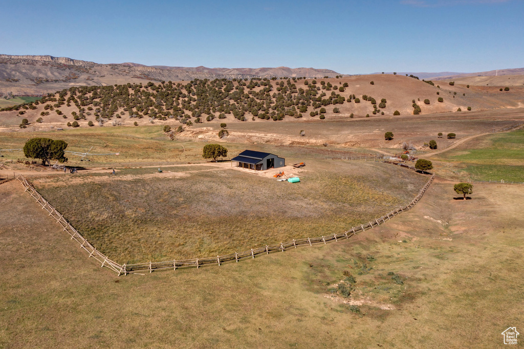 Birds eye view of property with a rural view and a mountain view