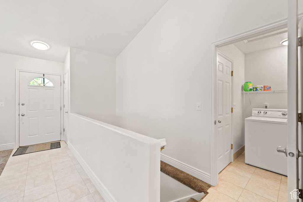 Tiled foyer with washer / dryer