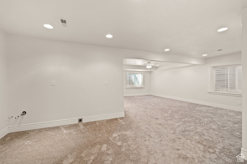 Unfurnished room featuring light carpet