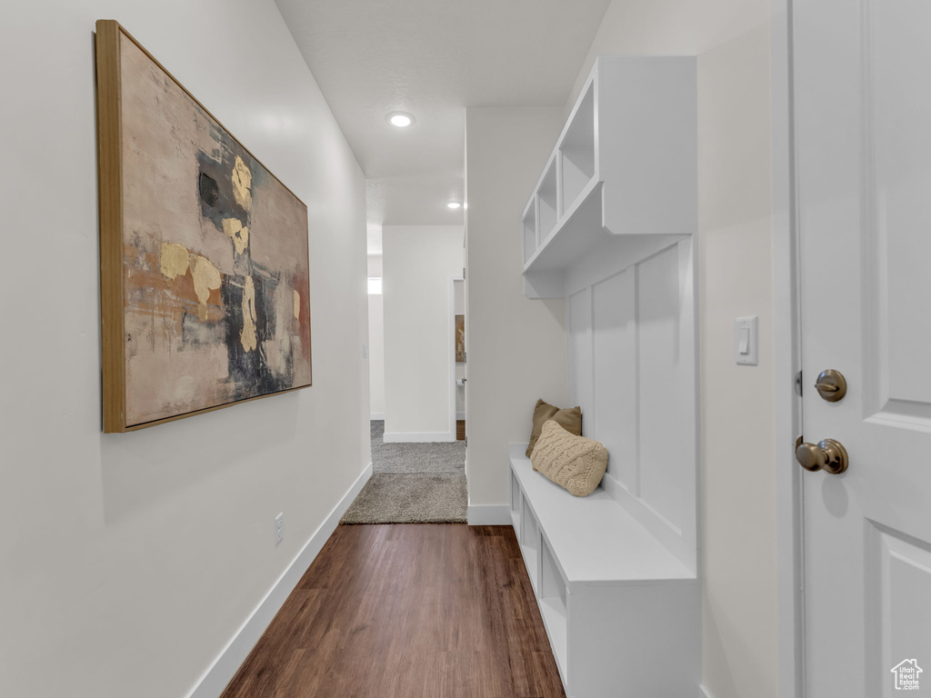 Mudroom with dark wood-type flooring, recessed lighting, and baseboards