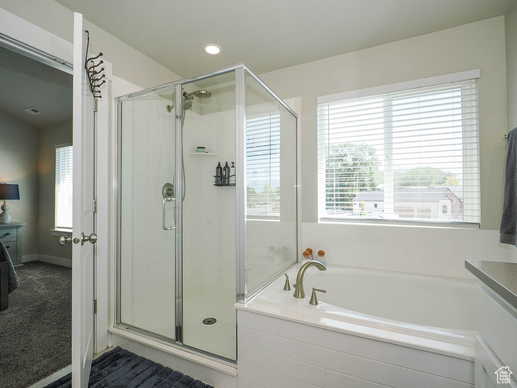 Bathroom with independent shower and bath