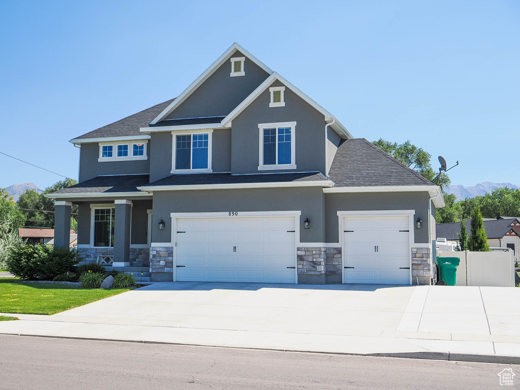 Craftsman-style home featuring a garage