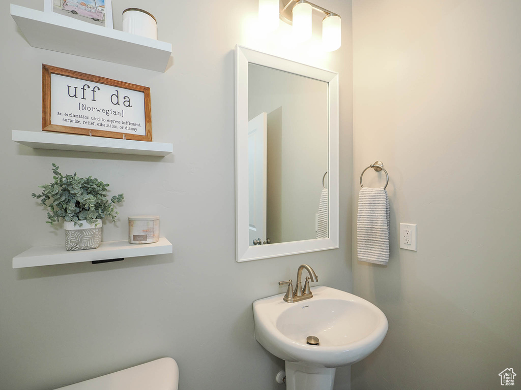 Bathroom featuring toilet and sink