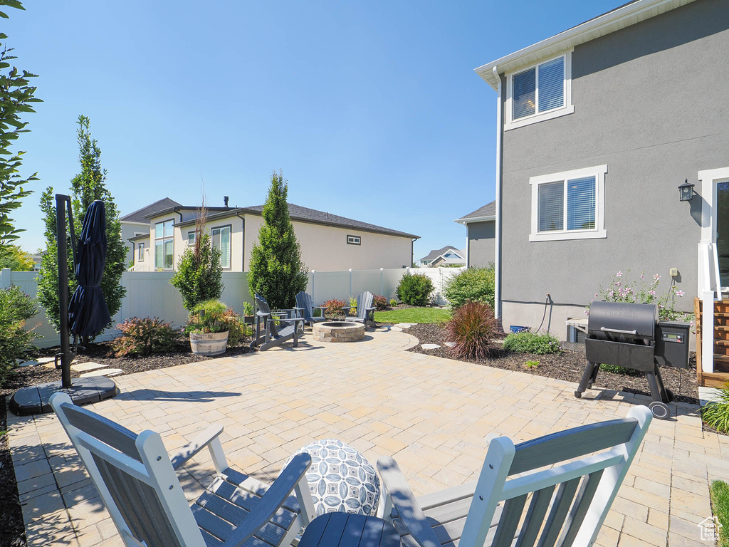 View of patio / terrace featuring an outdoor fire pit