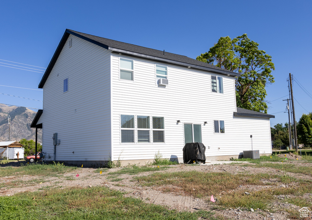 Back of property with central AC