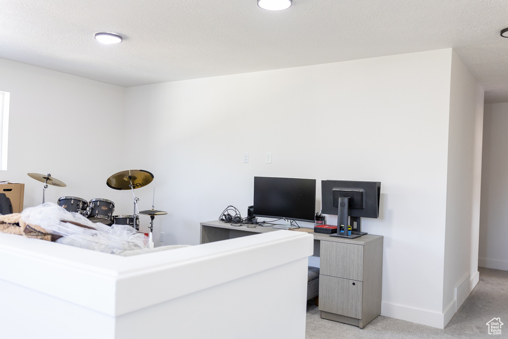 View of carpeted home office