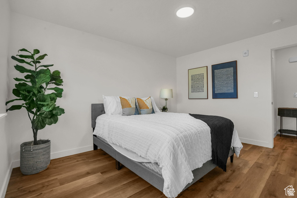 Bedroom featuring wood-type flooring